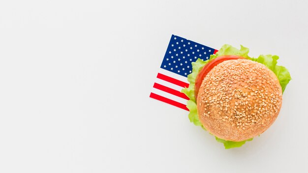 Flat lay of burger with copy space and american flag