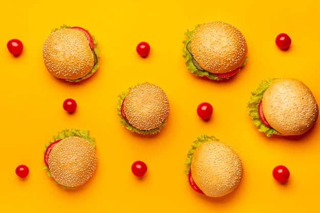 Flat lay burgers with orange background