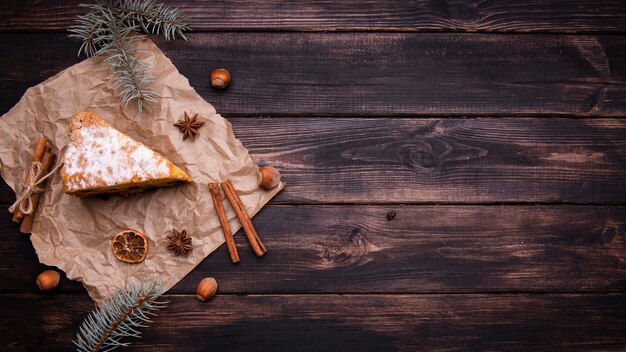 Flat lay of cake slice with cinnamon and copy space