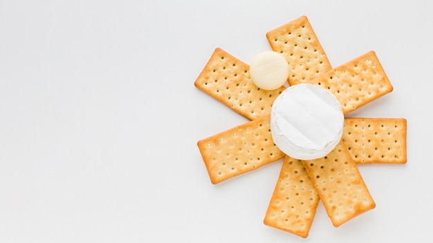 Flat lay camembert on crackers