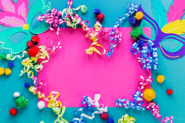 Flat lay of carnival masks and confetti