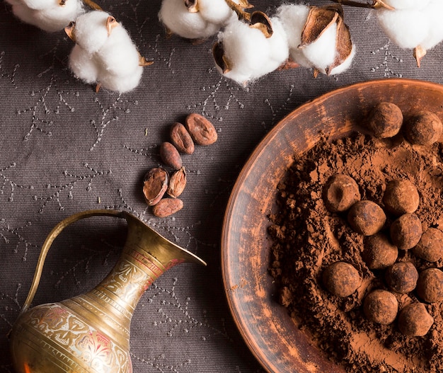 Flat lay chocolate truffles in cocoa powder