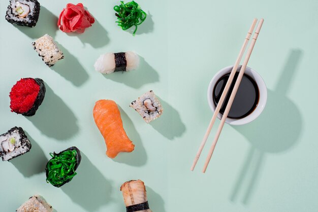 Flat lay chopsticks and sushi rolls for sushi day