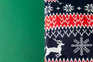 Free photo flat lay christmas fabric with reindeer shapes