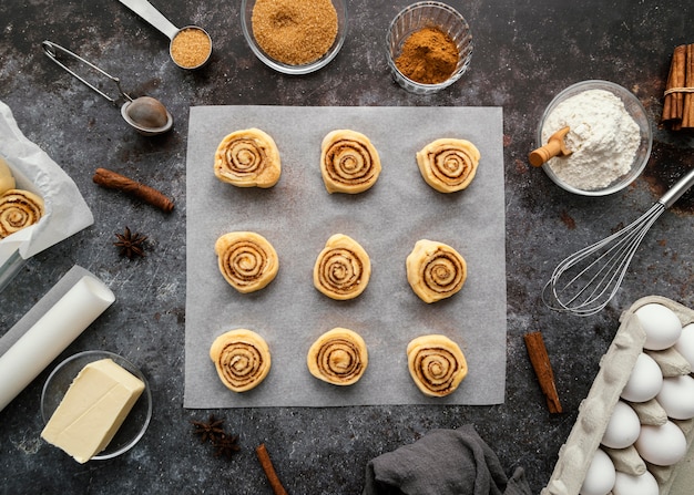 Flat lay cinnamon rolls and spices