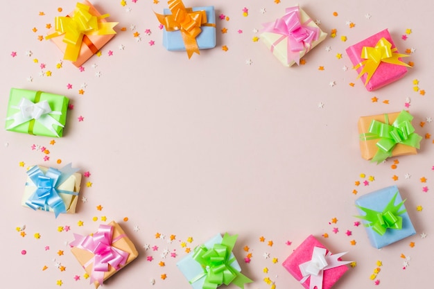 Flat lay colorful gifts on table with copy space