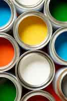 Free photo flat lay colorful paint cans  arrangement