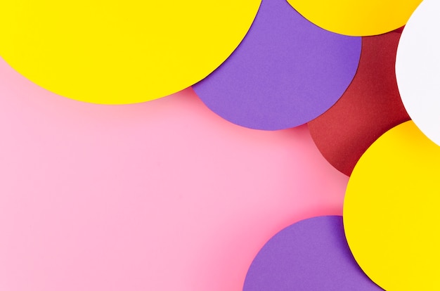 Free Photo flat lay of colorful paper circles with copy space