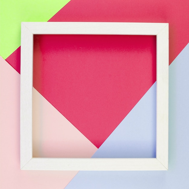 Free Photo flat lay of colorful paper cut-outs with frame on top