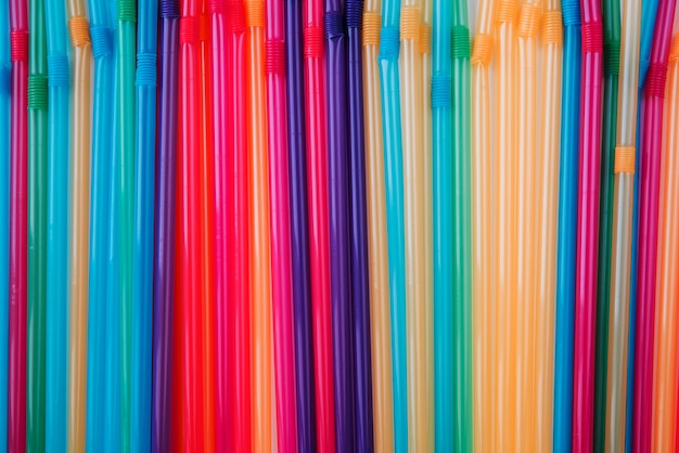 Free photo flat lay colorful plastic straws