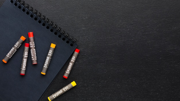 Flat lay colourful crayons and pencils