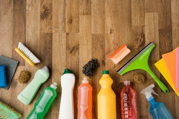 Flat lay composition of cleaning products with copyspace