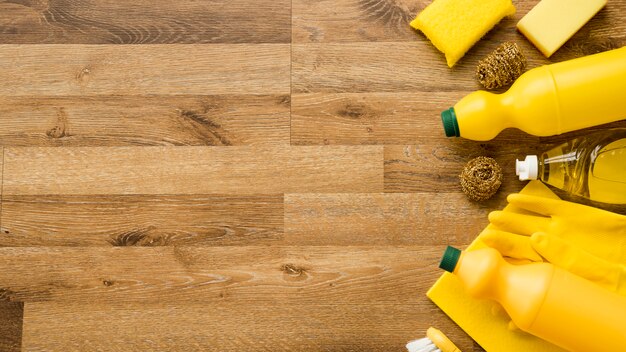 Flat lay composition of cleaning products with copyspace