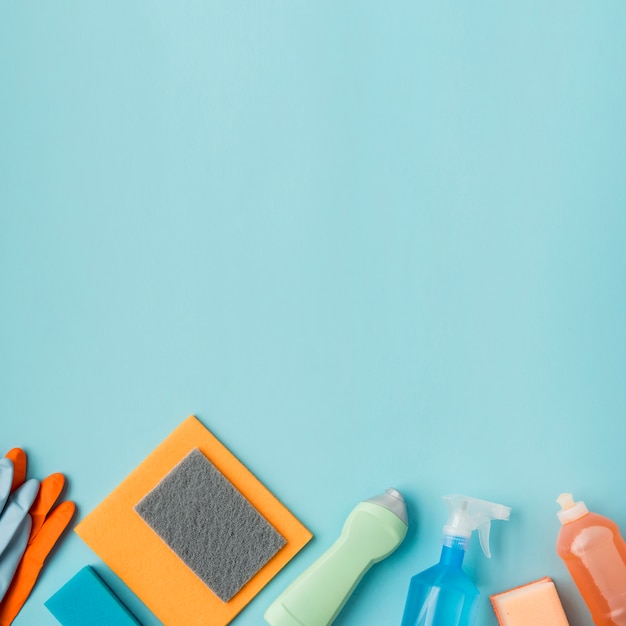 Flat lay composition of cleaning products with copyspace