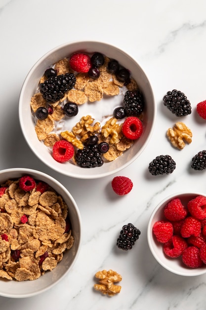 Flat lay composition of healthy bowl cereals with berries