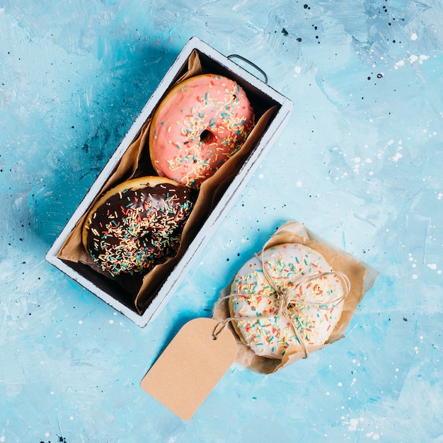 Free Photo flat lay composition of tasty donuts