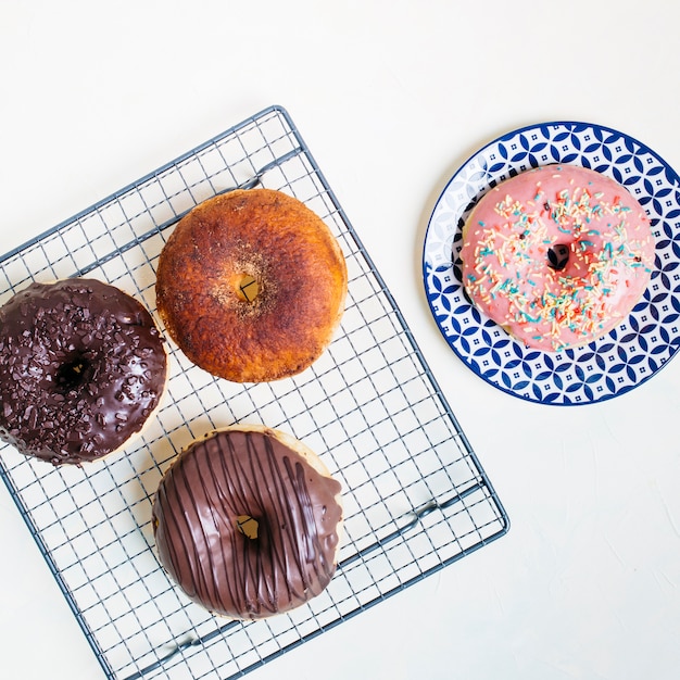 Free Photo flat lay composition of tasty donuts