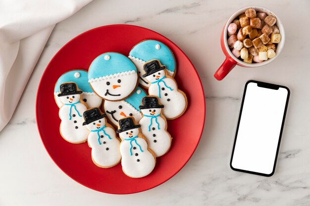 Flat lay of cookies in snowman shape concept