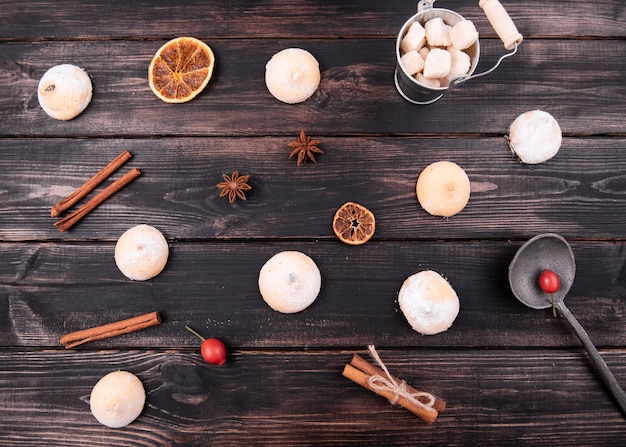 Flat lay of cookies with cinnamon and dried citrus