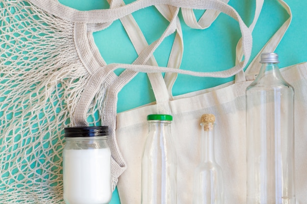 Free Photo flat lay cotton bag and bottles arrangement 