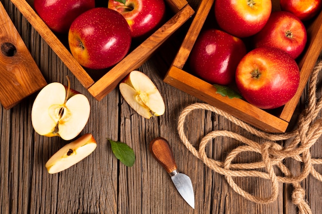 Free Photo flat-lay crate with ripe apples with rope