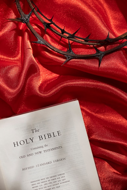 Free photo flat lay crown of thorns on red cloth