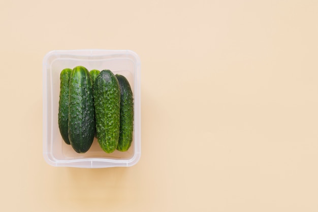 Free photo flat lay of cucumbers with copy space