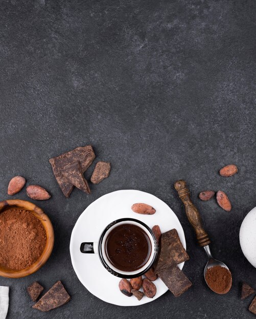 Flat lay cup of hot chocolate with copy-space