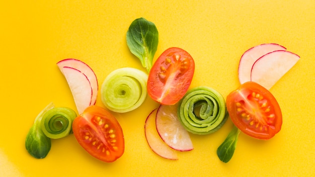 Free photo flat lay cut vegetables