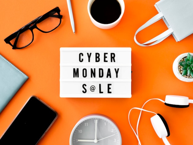 Free photo flat lay of cyber monday light box with shopping bag and coffee