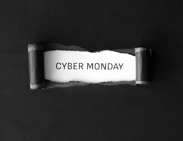 Free photo flat lay of cyber monday with ripped paper