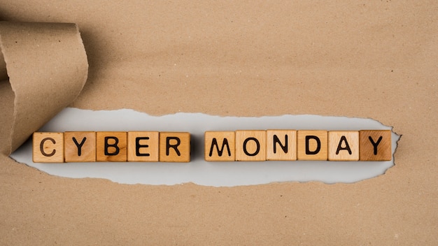 Free photo flat lay of cyber monday word on craft paper