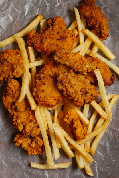 Flat lay delicious boneless chicken and fries