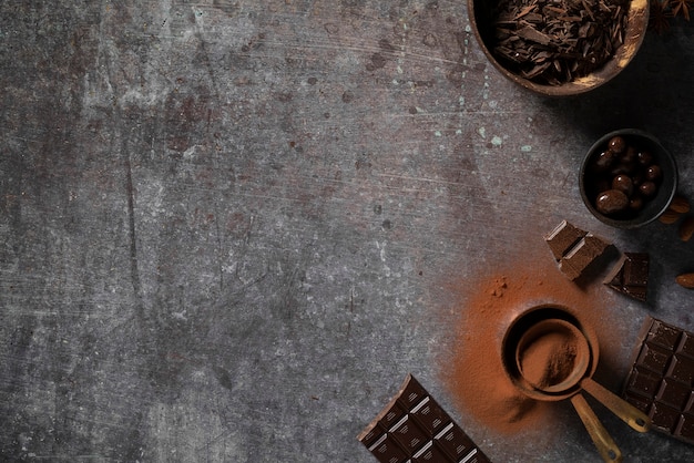 Flat lay delicious chocolate tablets and cocoa