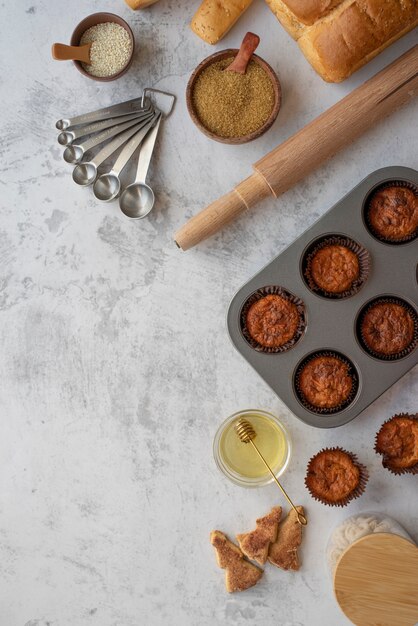 Flat lay delicious cupcakes and ingredients