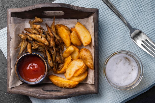 Flat lay of delicious fish and chips concept