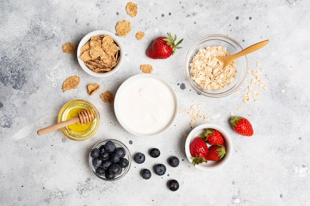 Flat lay delicious fruits in bowls