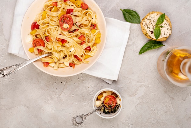 Free photo flat lay of delicious italian food on plain background