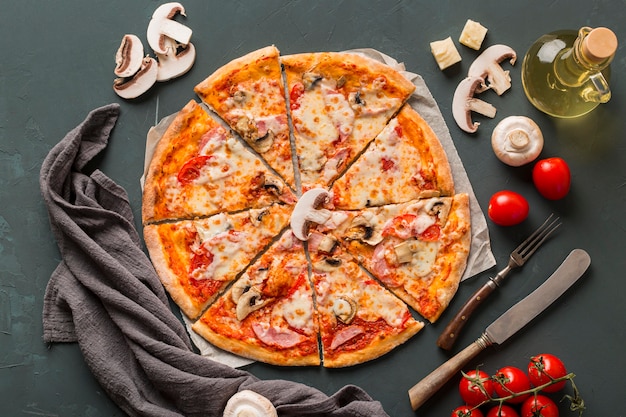 Flat lay of delicious pizza with mushrooms