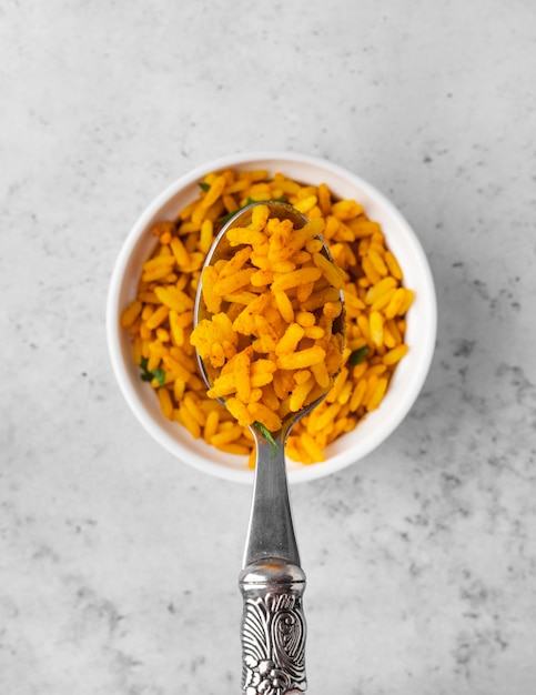 Free Photo flat lay delicious yellow rice in bowl