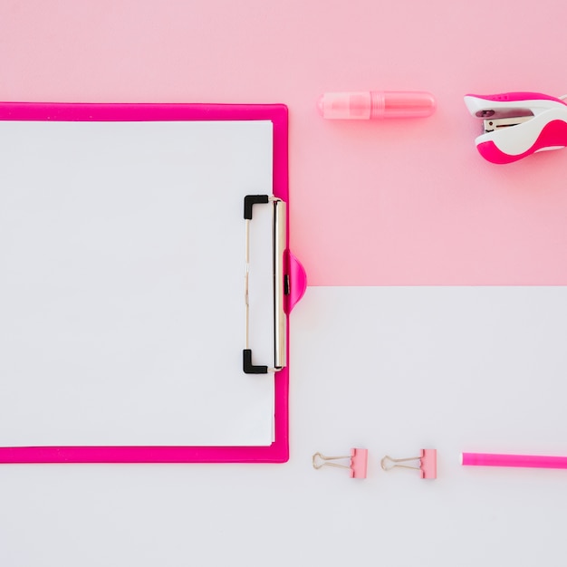 Flat lay desk arrangement with clipboard