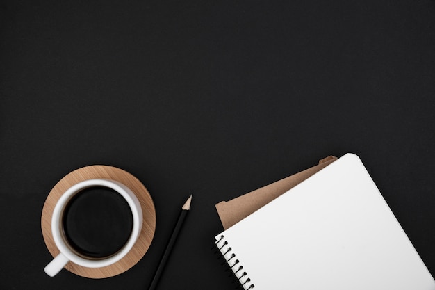 Flat lay of desk dark concept with copy space