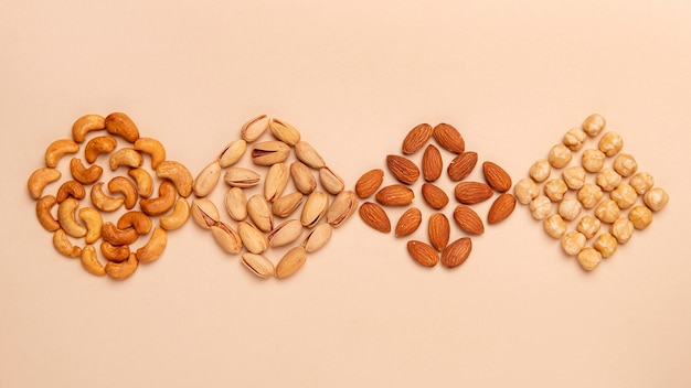 Free photo flat lay different nuts arrangement