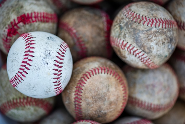 Flat lay of dirty baseballs