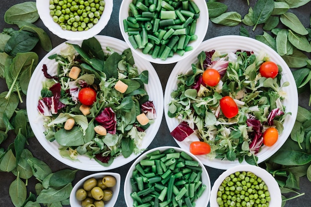 Flat lay of dishes with salads and green beans