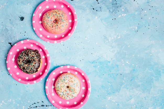 Free Photo flat lay donut composition with copyspace