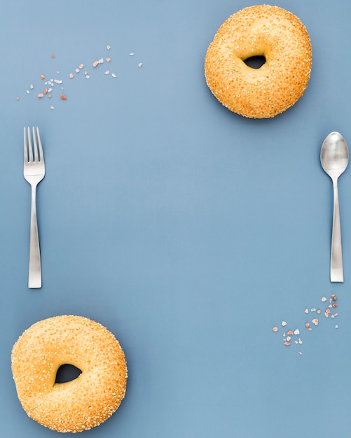 Flat lay of donuts with fork and spoon