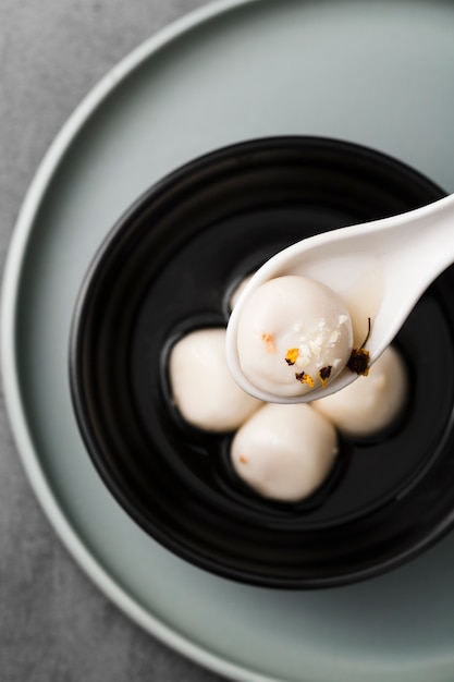 Free photo flat lay of dumpling in spoon with spices