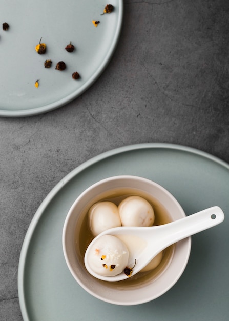 Flat lay of dumplings and spoon