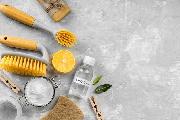 Flat lay of eco-friendly cleaning products with copy space